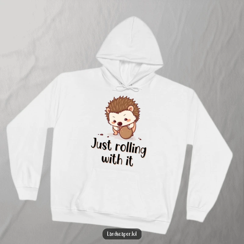 Funny Hedgehog Hoodie: A determined hedgehog enthusiastically rolls a dirt ball, showcasing its funny, focused spirit on a cozy hoodie.